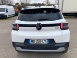 the rear end of a white mercedes suv parked in a parking lot