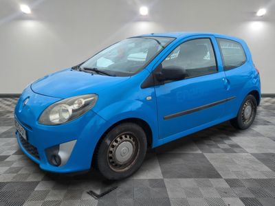 a picture of a small blue car parked in a garage
