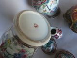 many vases that are sitting on a table