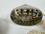 a glass bowl that has some yarn and a ball of yarn