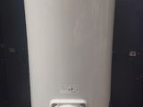 a white water heater sitting on a pallet on a pallet