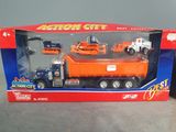 toy truck with construction equipment in box on table with grey background