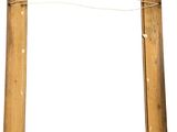 an old wooden picture frame hanging on a wall with a string