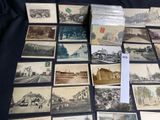 a lot of old postcards that are on a table