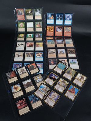 a bunch of cards are sitting on a table with a black background
