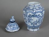 a blue and white vase next to a small blue and white vase
