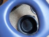 a blue plastic chair with a black seat and a black handle