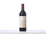 a close up of a bottle of wine sitting on a table
