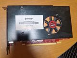 a close up of a video card sitting on top of a wooden table