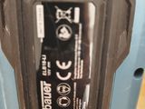 a close up of a cordless drill with a battery attached to it