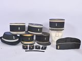 many hats that are sitting on a mannequin head