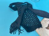 a black bag with a black scarf and a black bag with a black scarf on it