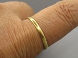 a close up of a person ' s hand with a ring on it