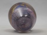 a glass ball with a picture of a man on it