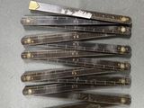 six pairs of scissors sitting on top of a table next to each other