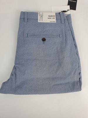 a close up of a pair of blue pants on a white surface