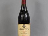 a bottle of wine that is sitting on a table