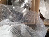 many pieces of plastic wrapped in a box