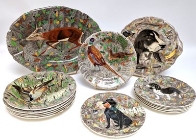 many plates with different designs of animals on them