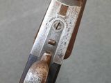 a close up of a gun that is being held by someone