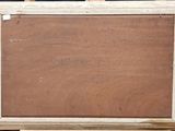 an old wooden easel with a painting on it on a black background