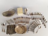 a lot of silverware and silverware on the table