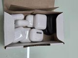 a box with a bunch of airpods inside of it