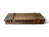 an old wooden crate with browning on it sitting on a white surface