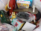 a basket filled with toys and other items for a child ' s play