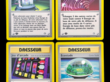 four different cards with different designs on them on a black background