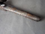 a baseball bat that is laying on the ground