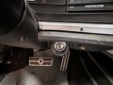 a close up of a car ' s dashboard with a radio on it
