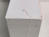 a close up of a piece of wood that has been painted white