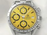 une image représentant une montre au cadran jaune sur un fond blanc