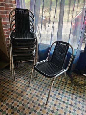 two chairs sitting next to each other in front of a window