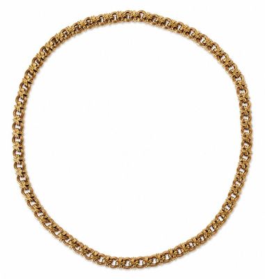 a gold chain necklace on a white background