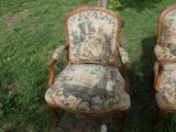 two chairs that are sitting in the grass