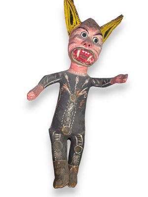 an image of a creepy looking doll made of wood