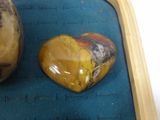 two rocks that are sitting on a blue mat