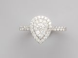 a white gold and diamond ring with a pear shaped center stone