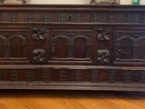 a wooden dresser with a mirror on top of it
