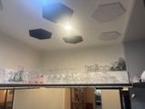 a lot of empty glasses on the shelf in the room
