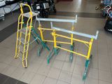 three ladders that are sitting on the floor in a store