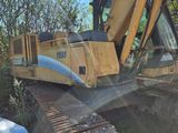 a yellow bulldozer that is sitting in the dirt