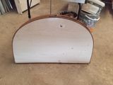 a white piece of furniture that is sitting on the floor