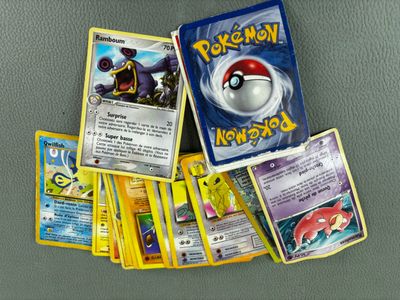 a lot of pokemon cards sitting on a table