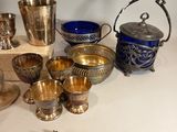 a table with a lot of silver items on it