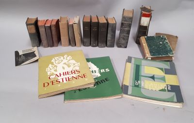 several books are arranged in a circle on a white surface