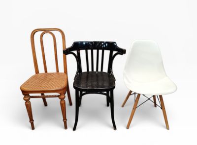 three chairs sitting next to each other on a white surface