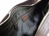 the inside of a black purse with a zipper on the inside
